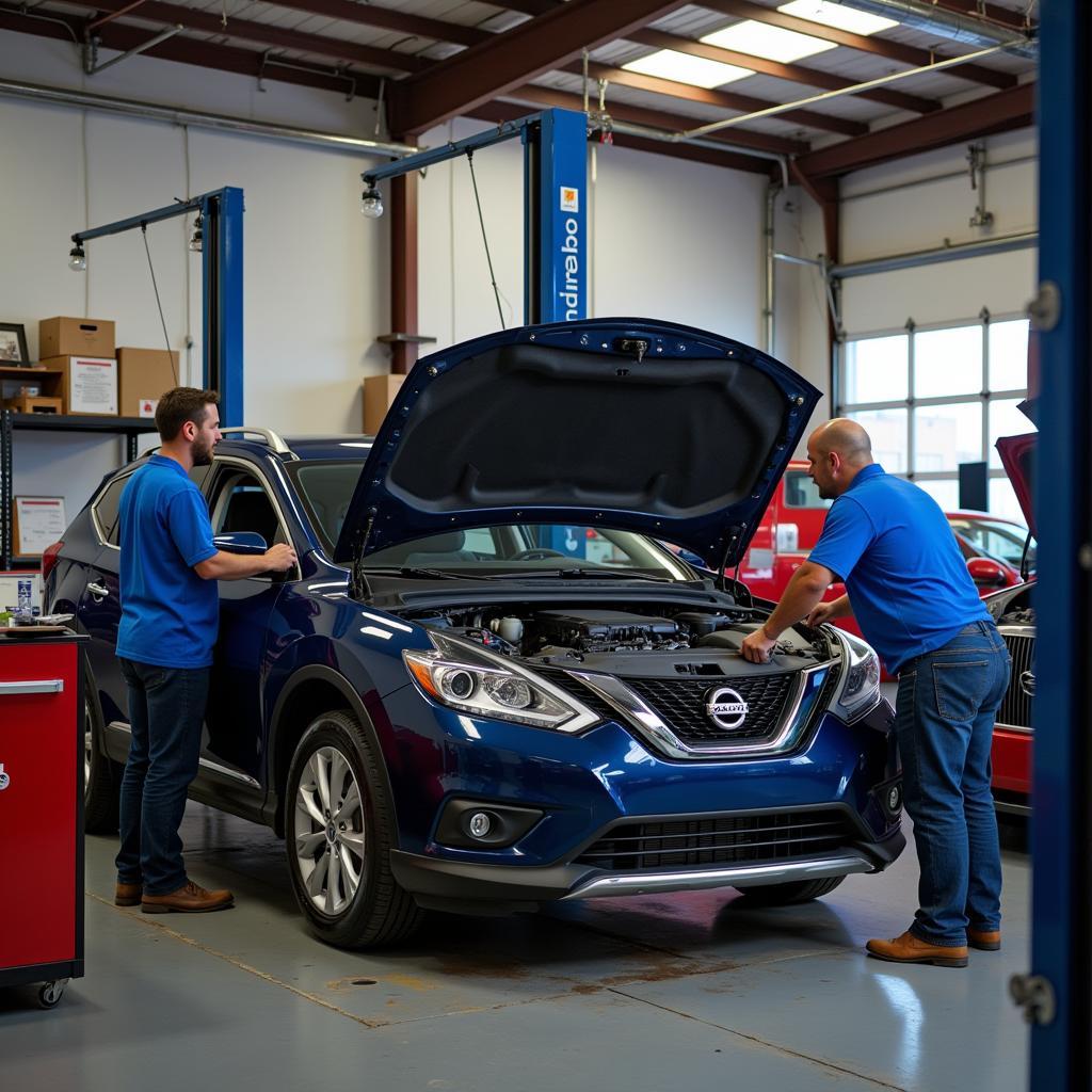 Anthony Auto Sales service center with mechanics working on a car