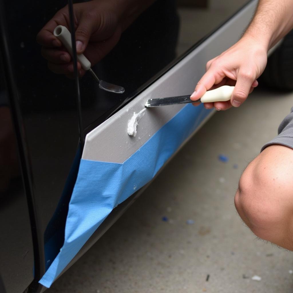 Applying Body Filler to Dent on Running Board