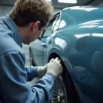 Auto Body Technician Using Computerized Paint Mixing System