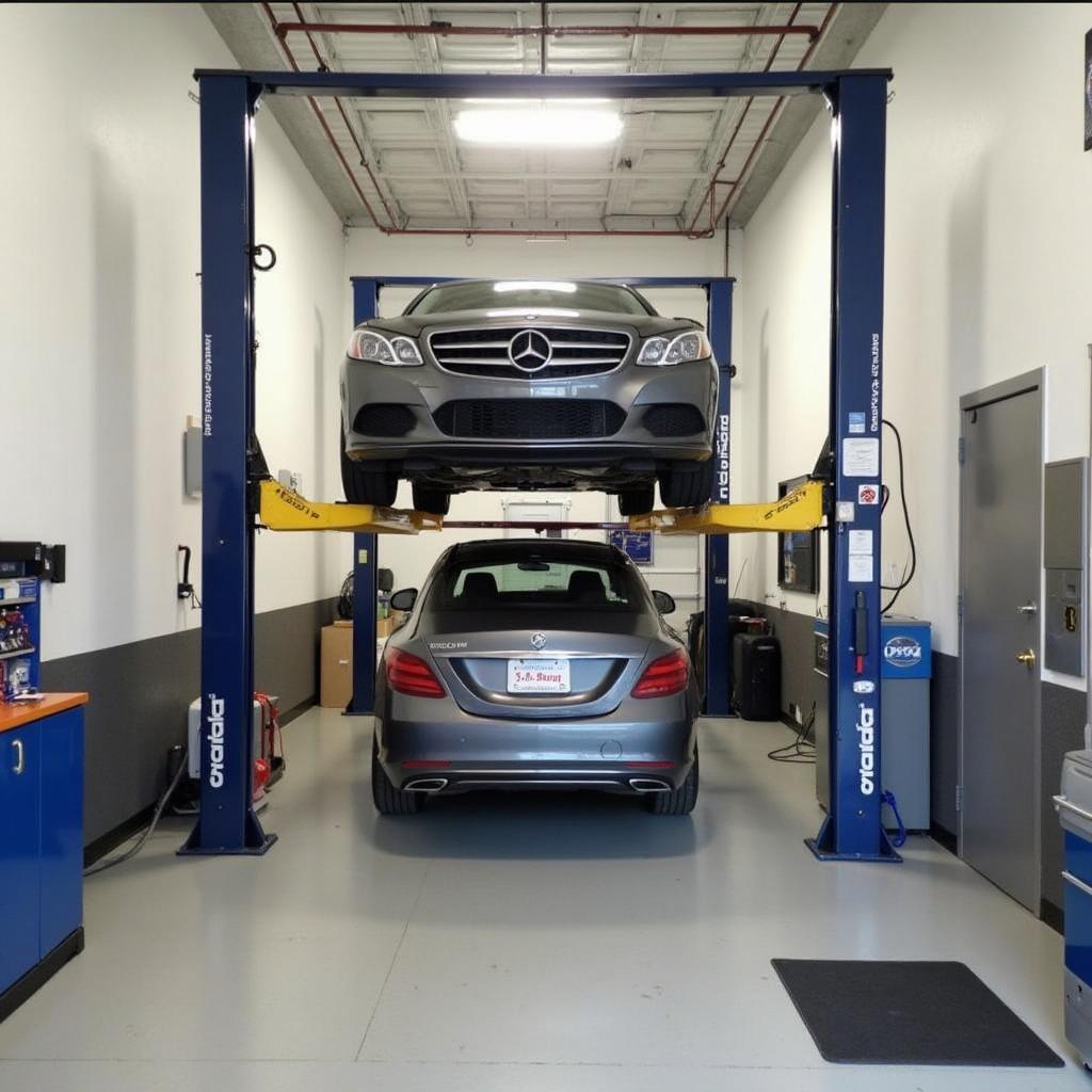 Modern auto repair shop interior with a car on a lift and tools.