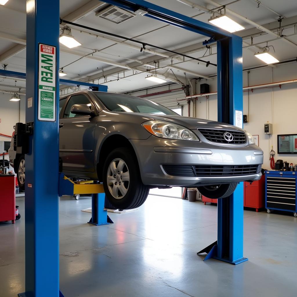 Car on a Lift in an Auto Service Bay in Orange Beach, AL