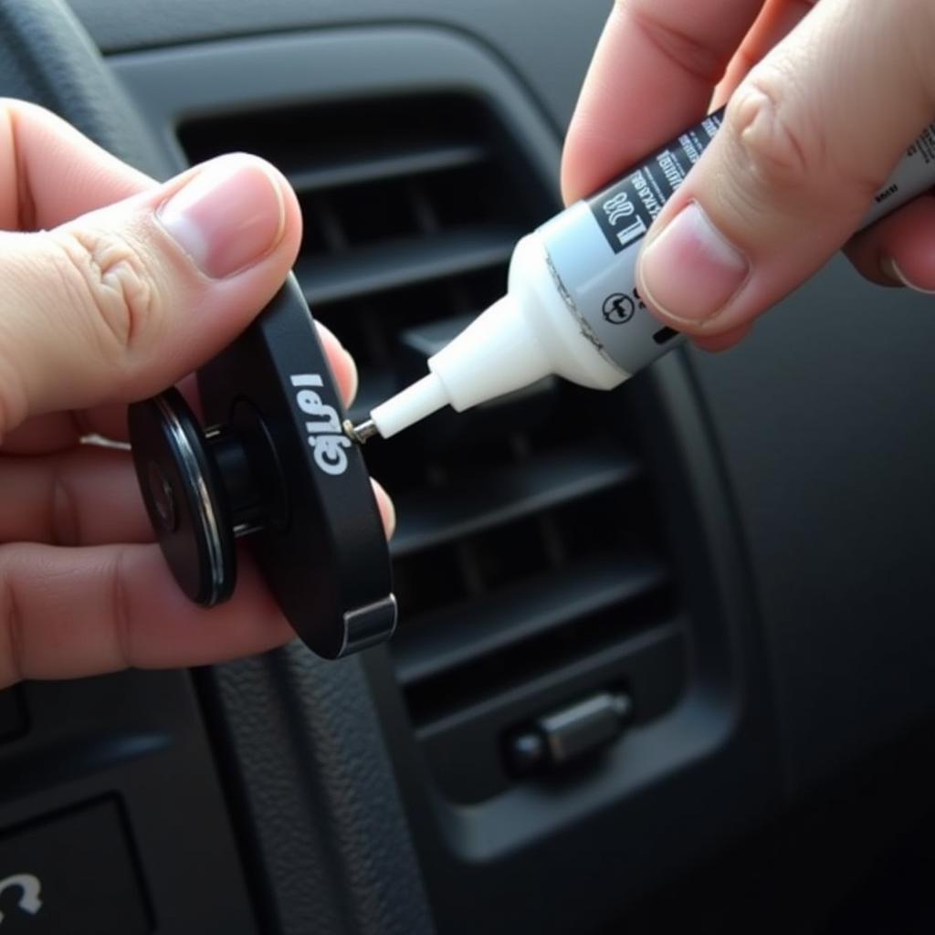 Repairing a broken car phone holder vent clip with adhesive