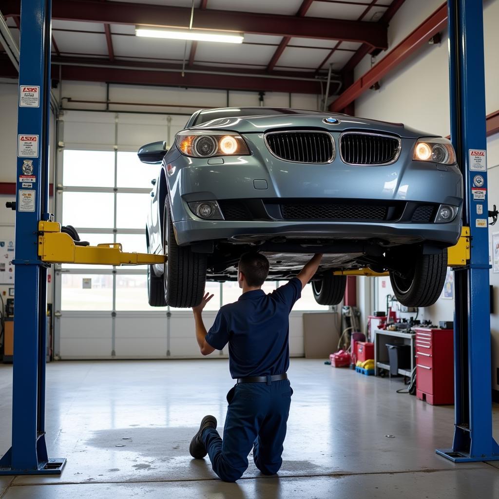 A car getting an oil change at an auto service center in Rock Island