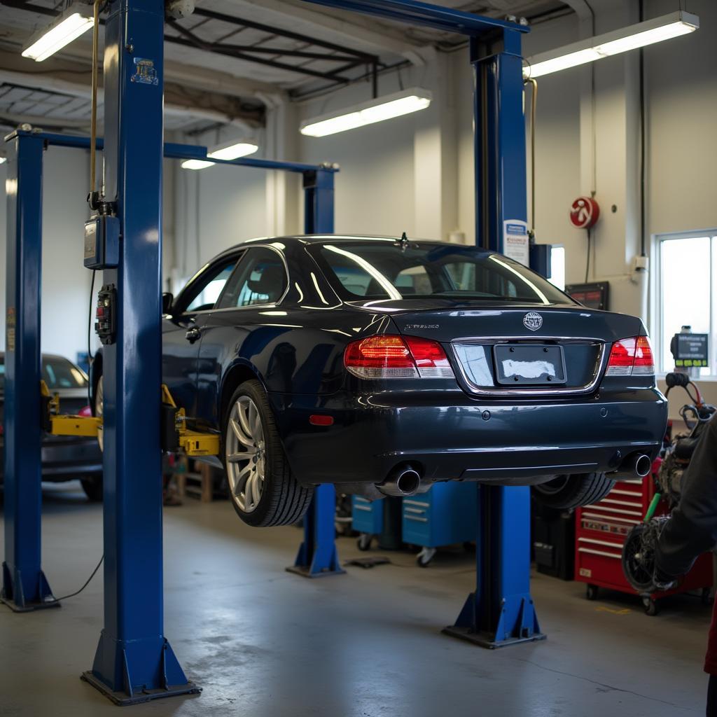 Car raised on a lift for transmission repair in Decatur