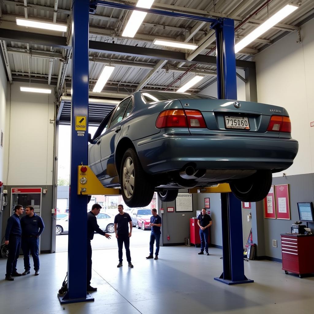 Car undergoing repairs at J's Auto service center