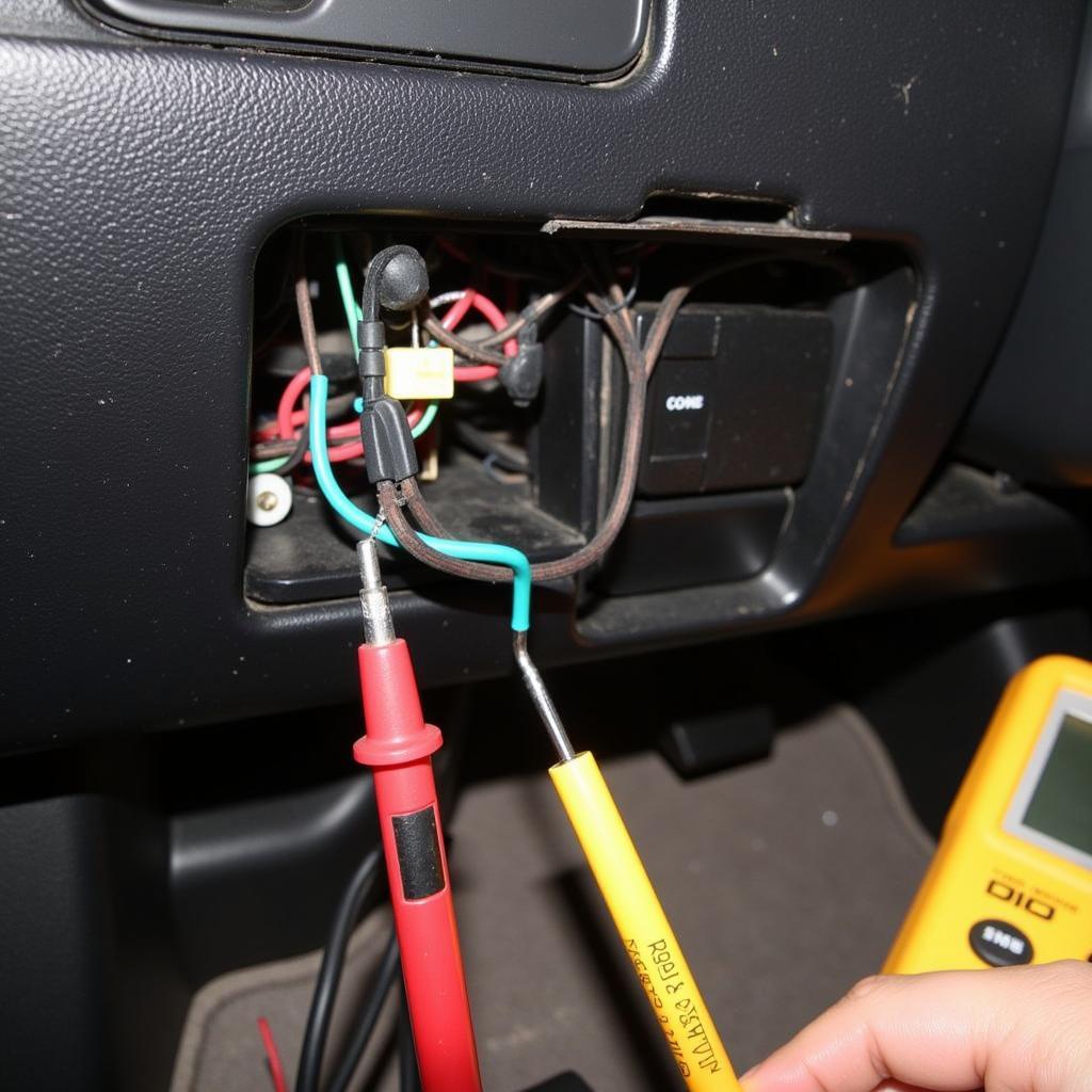 Inspecting the wiring connections behind a car stereo for damage and looseness