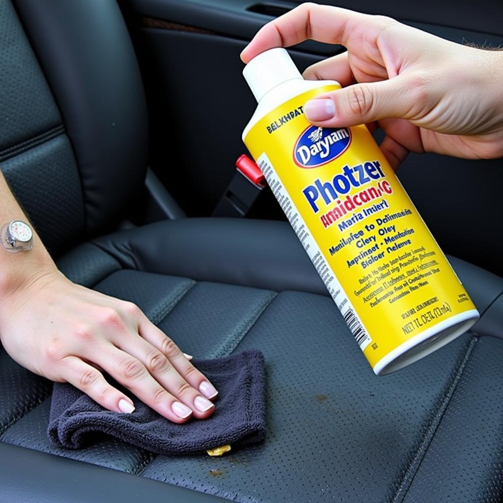 Cleaning stains on car seat upholstery with specialized cleaner