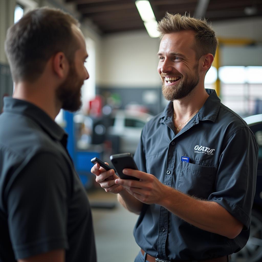 Mechanic Discussing Repairs with Customer