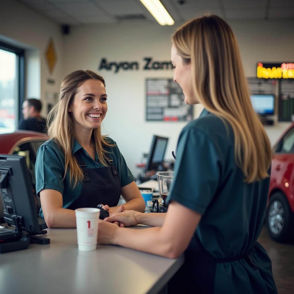 Friendly staff member assisting a customer at an auto service counter in Fulton, KY