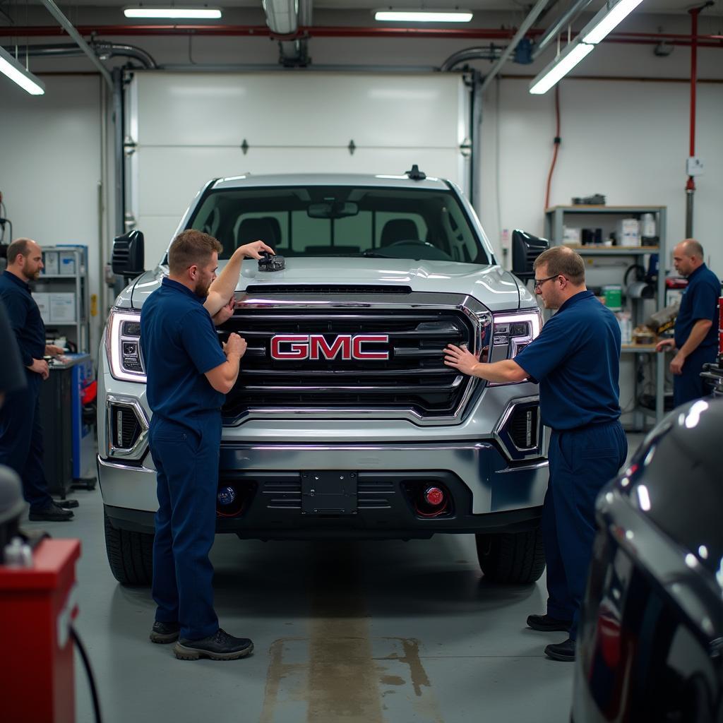 GMC Certified Technicians Working on a Vehicle