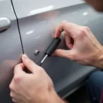 PDR process for hail dent removal on a car door