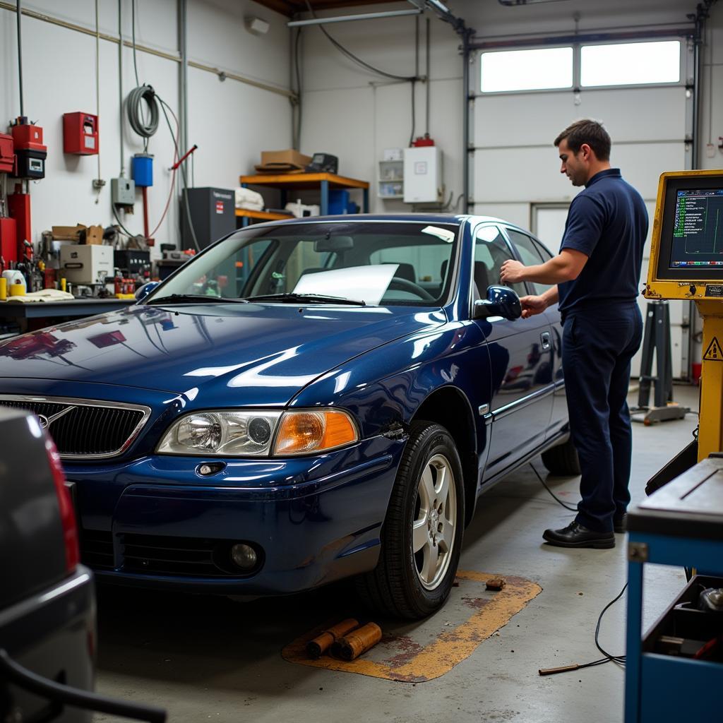 Professional car body repair: A car being repaired in a professional auto body shop.