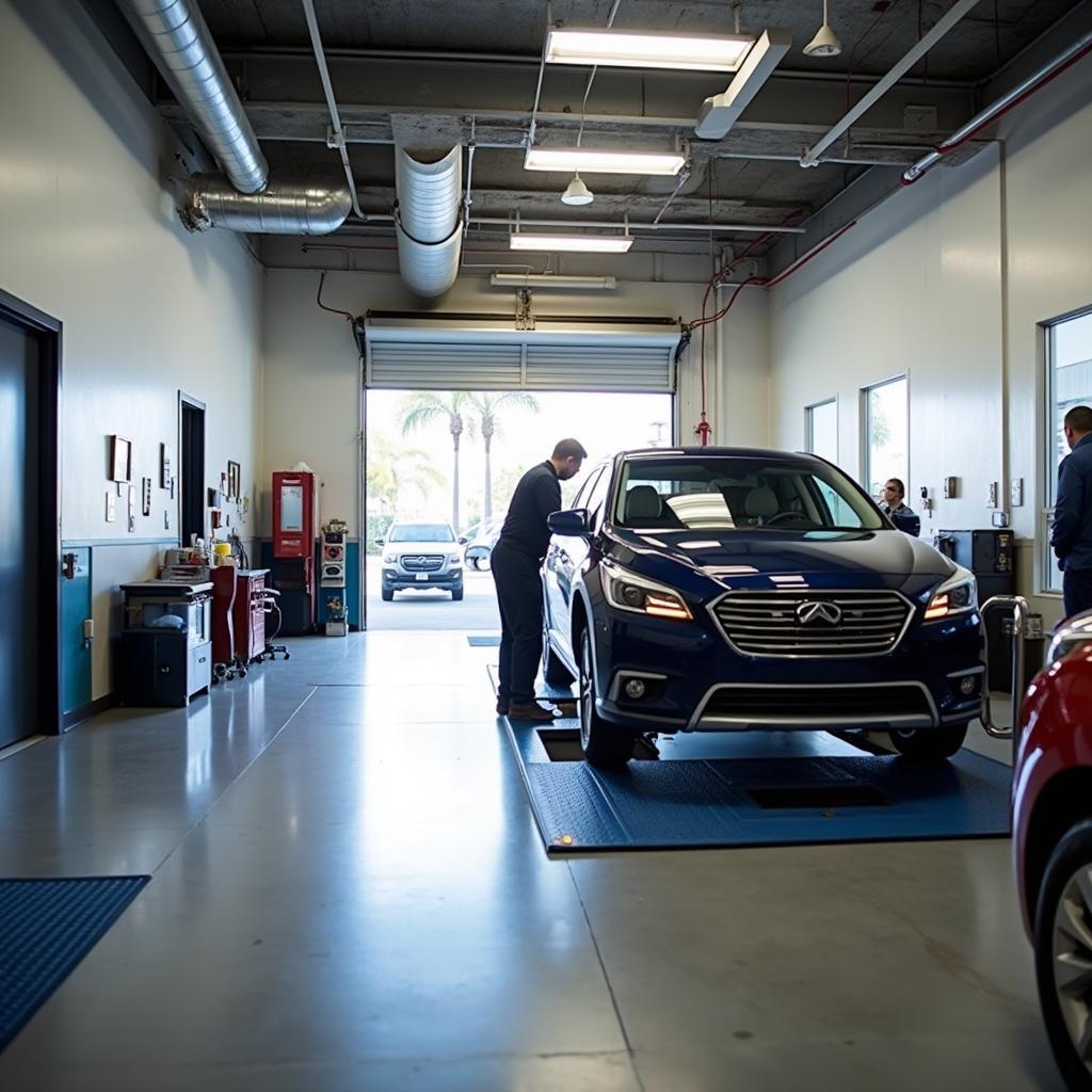 Rancho Bernardo auto repair shop interior with a car on a lift