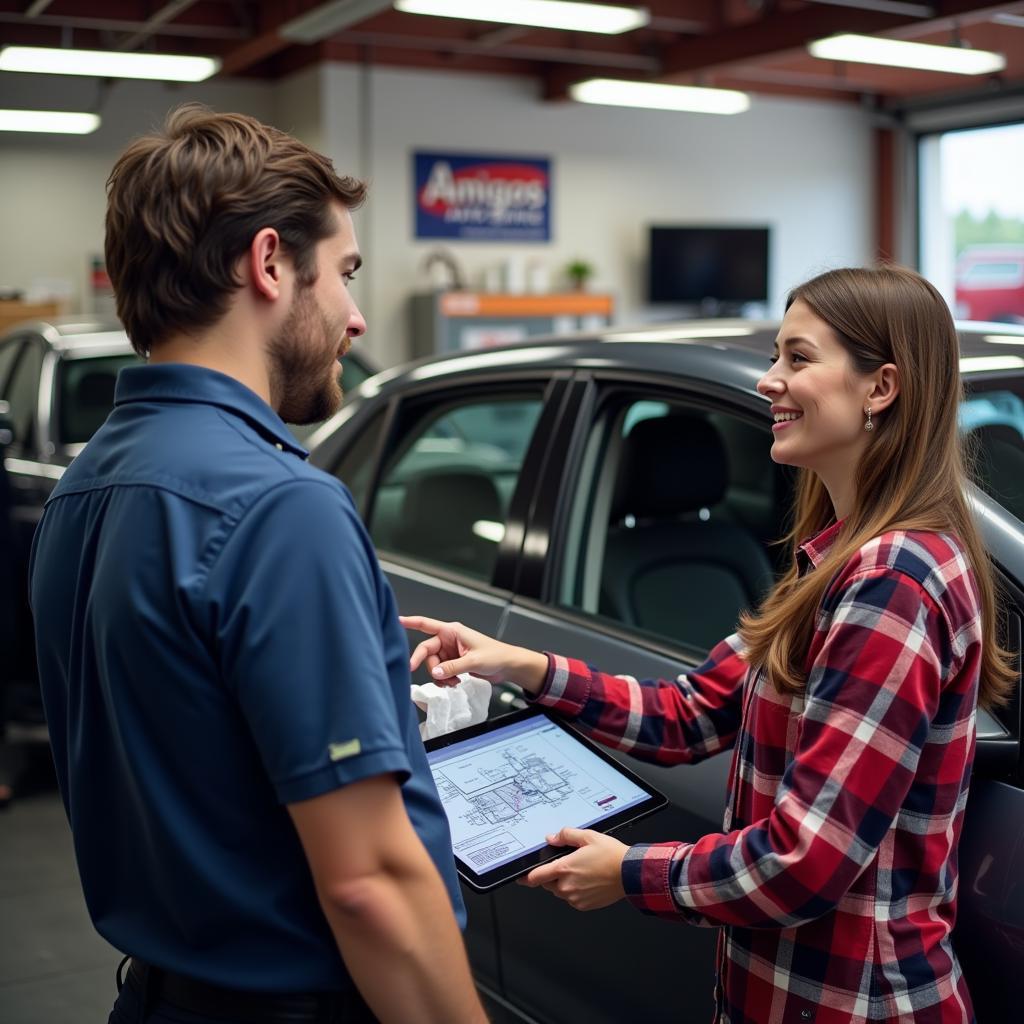 Customer Discussing Car Repairs with a Mechanic