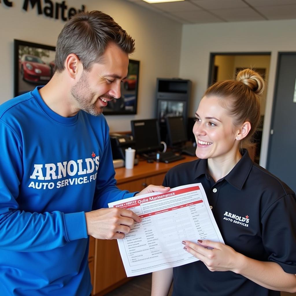 Customer service representative discussing car maintenance with a client at Arnold's Auto Services