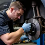 Technician Performing Brake Service in a Smithfield RI Auto Center