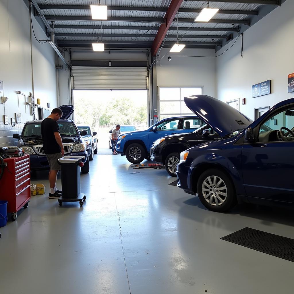 Modern Auto Repair Shop with Technicians Working in New Smyrna Beach, FL