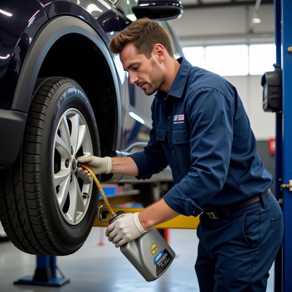 Oil change service being performed on a car in Madera, CA