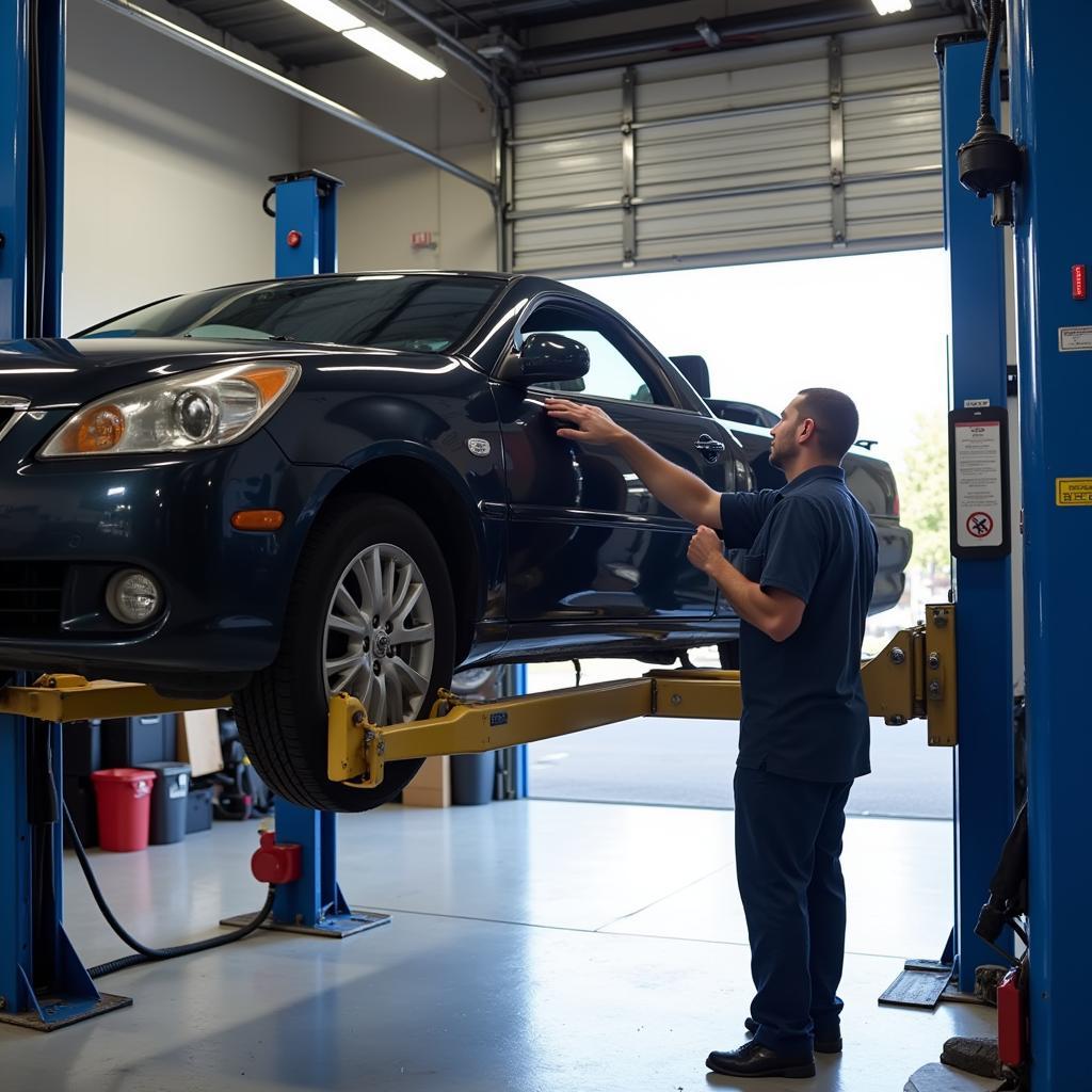 Car Undergoing Inspection on a Lift at an Auto Service Center in Santee