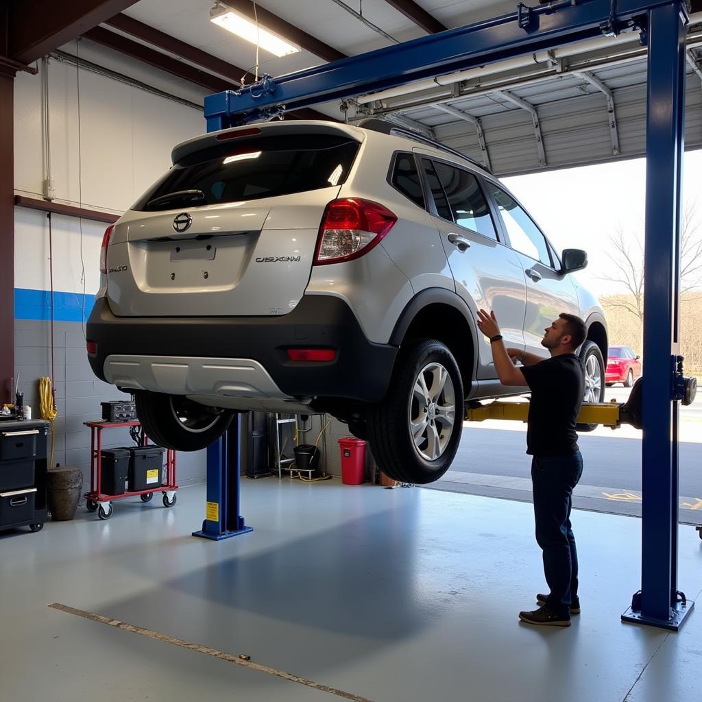 Car undergoing routine maintenance on a lift in Urbana, MD