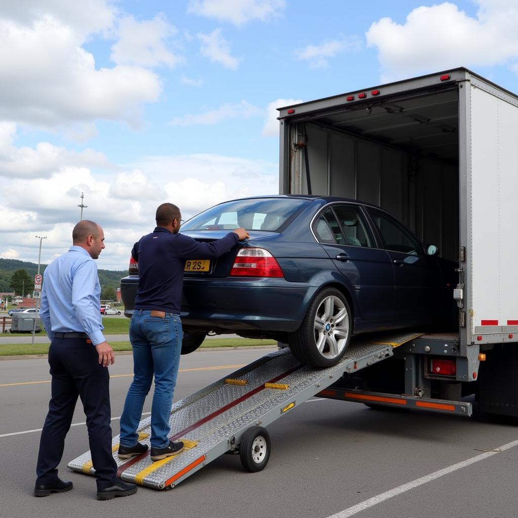 Car Being Loaded onto Transport Truck