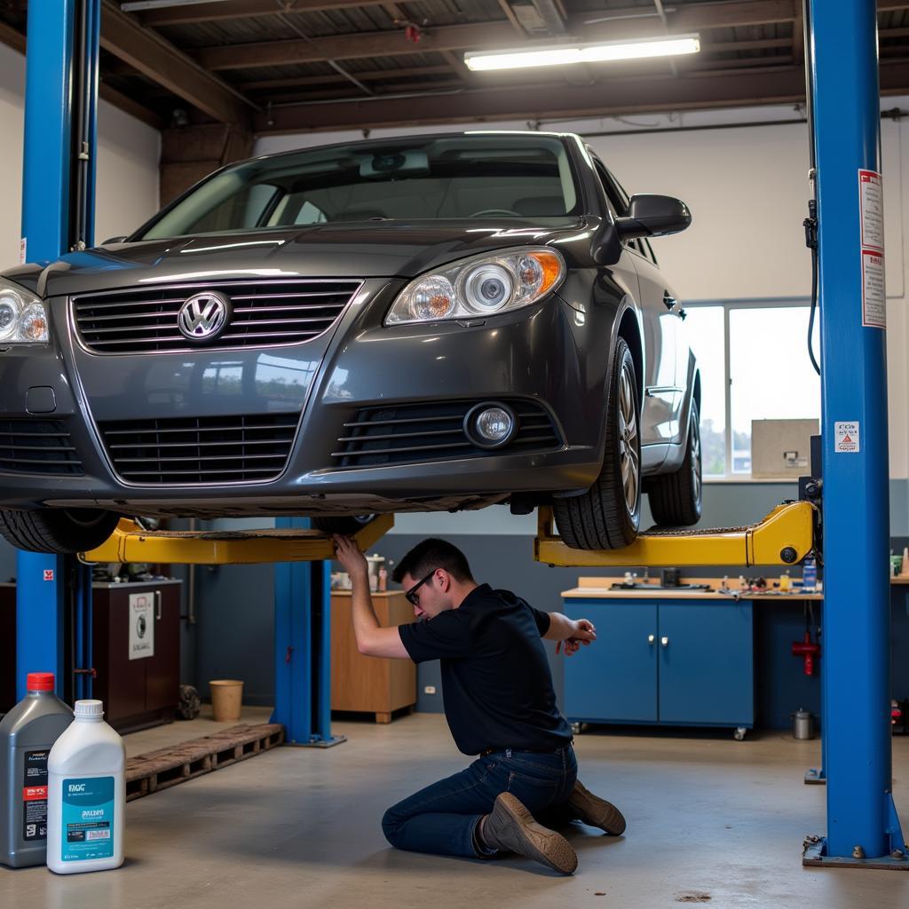 Car on a lift getting an oil change.