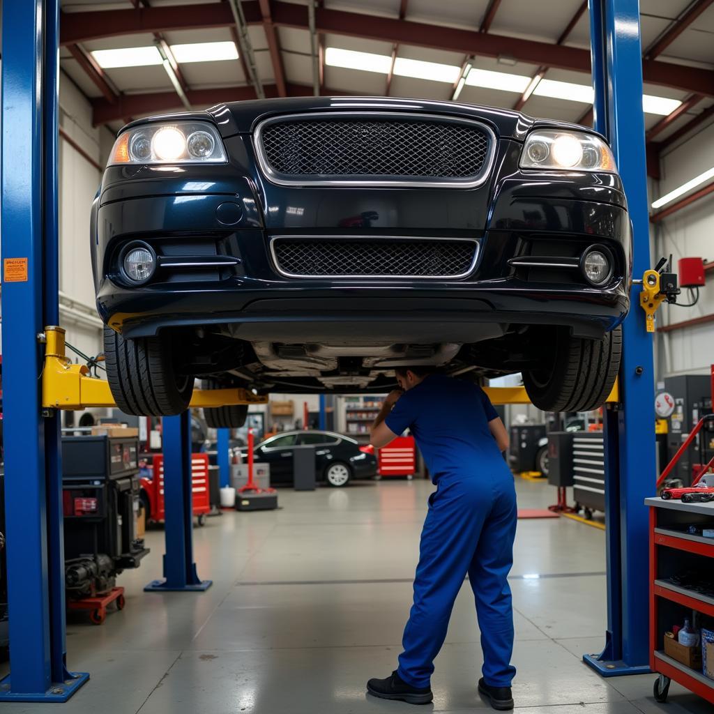 A car on a lift at an auto service center in Burton, Ohio undergoing inspection