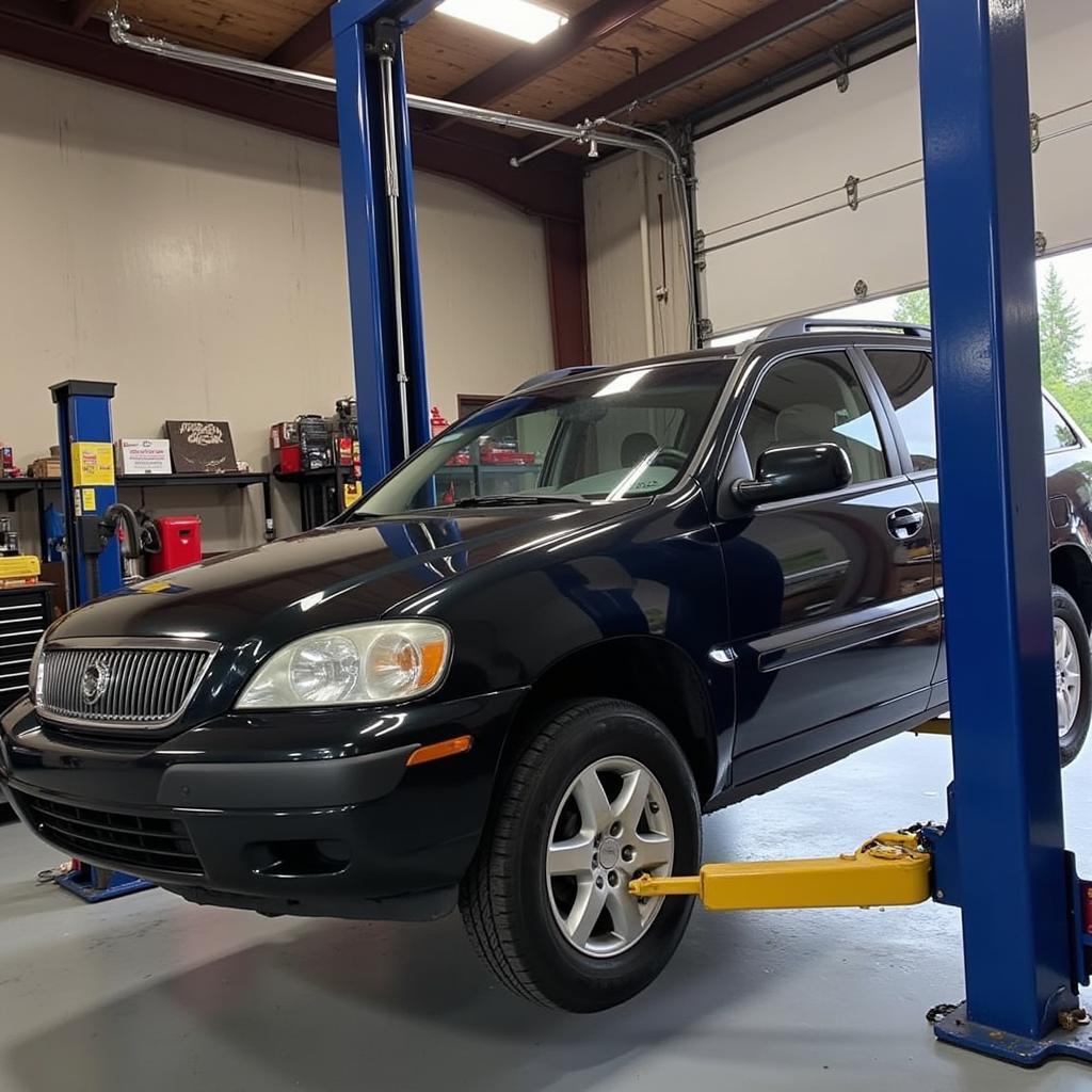 Car on a lift undergoing repairs in a Marysville, WA auto repair shop