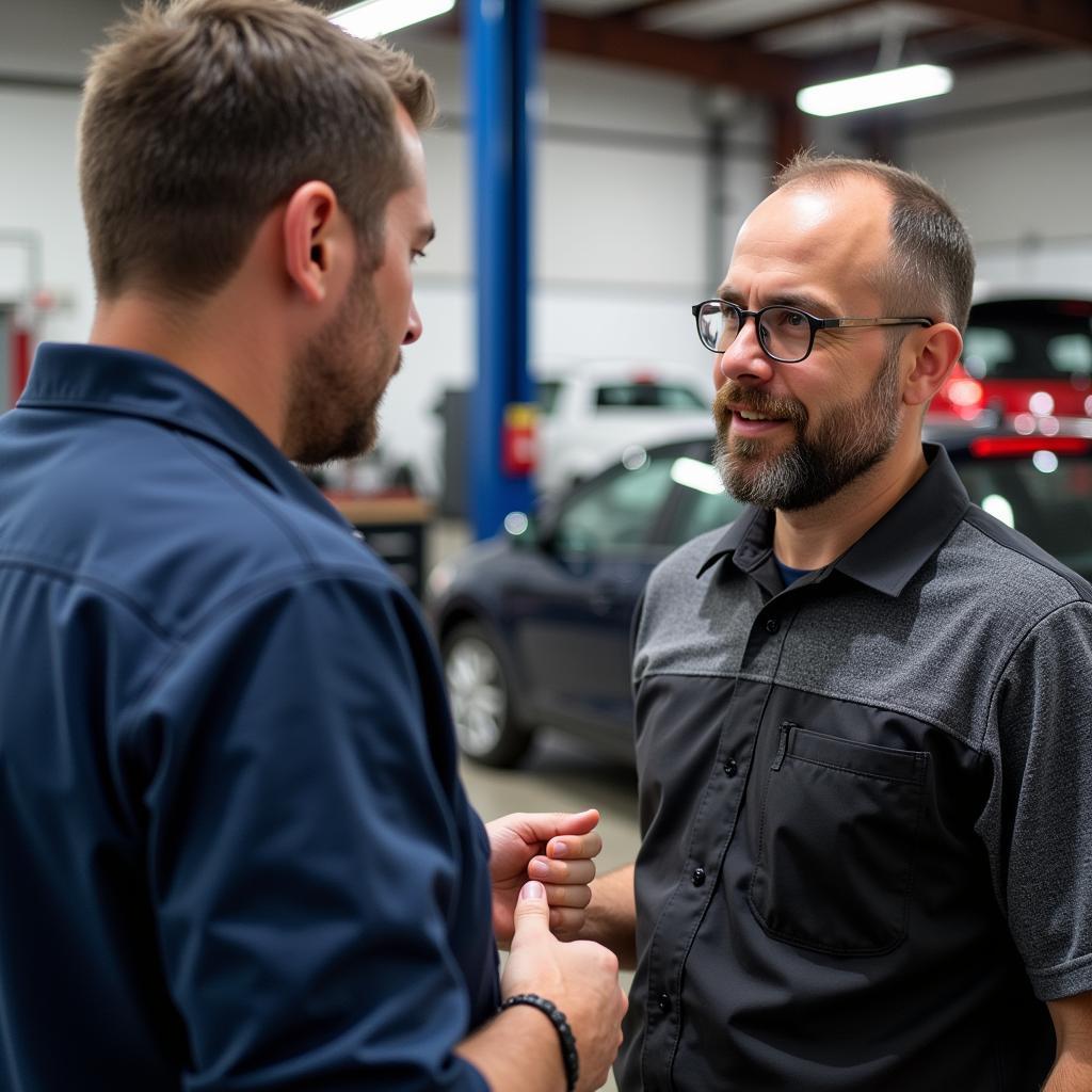 Customer Asking Questions to a Service Advisor in a Duluth Auto Center