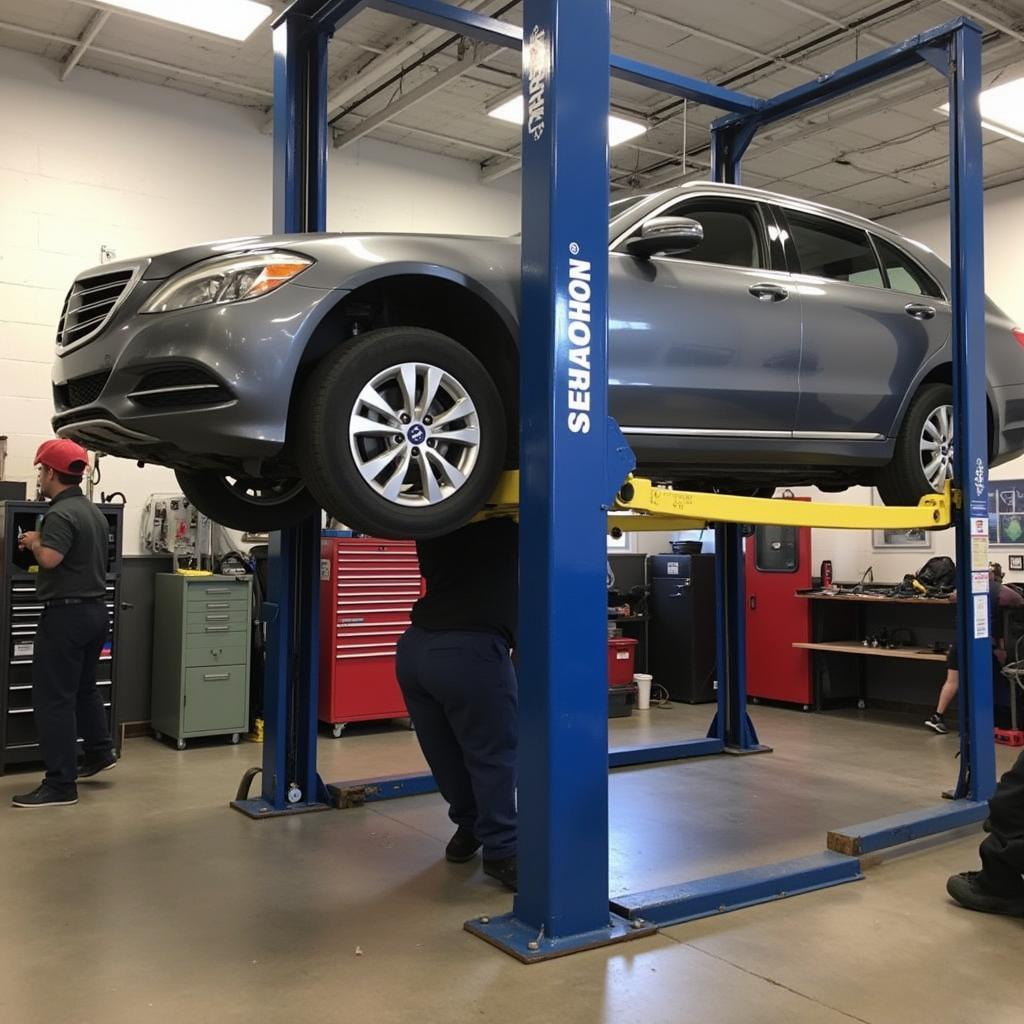 Car Undergoing Repairs in a Dedham Auto Service Bay