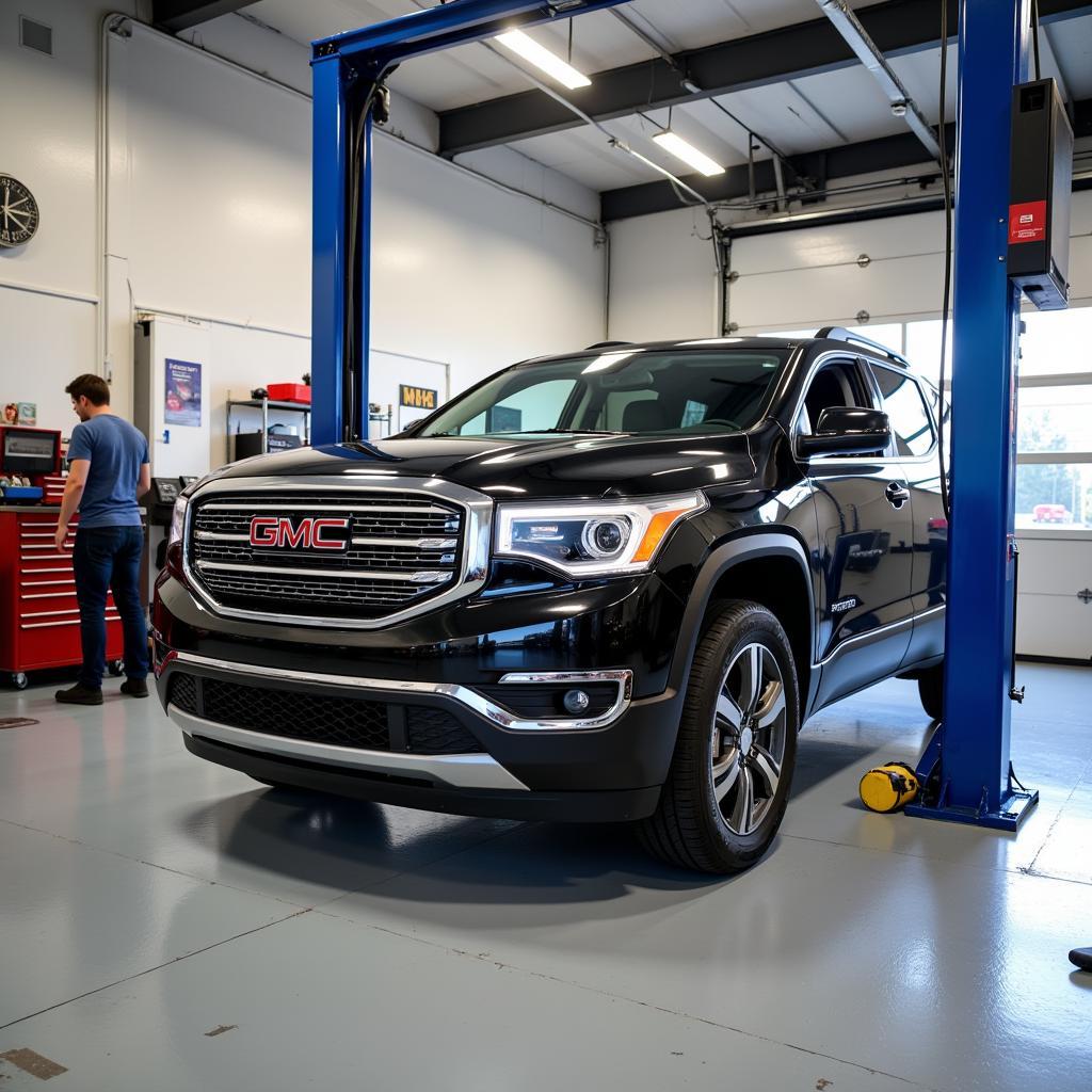 GMC Acadia undergoing service at a reputable auto shop on 1a Street Southwest, Calgary, AB