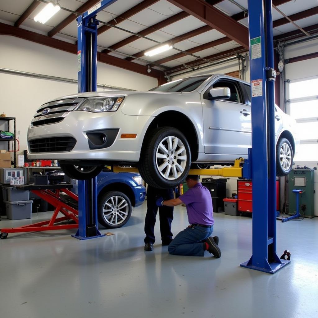 Car on a lift in a Hickory auto service shop being repaired