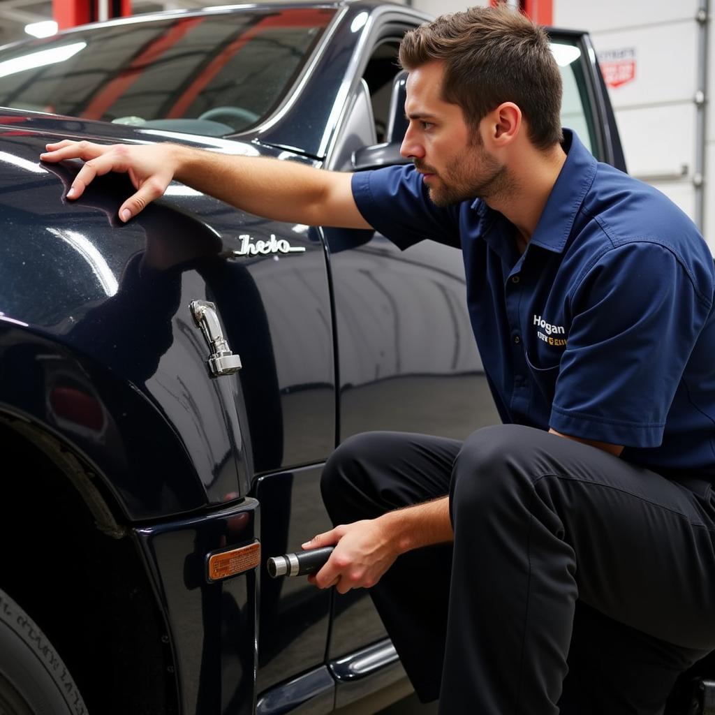 Hogan Tire & Auto Service Technician Working