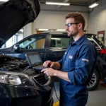 Hopkins Tire & Auto Service Technician Performing Vehicle Inspection