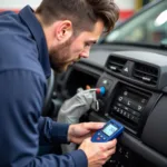 Mechanic inspecting car AC system in Palm Beach Gardens