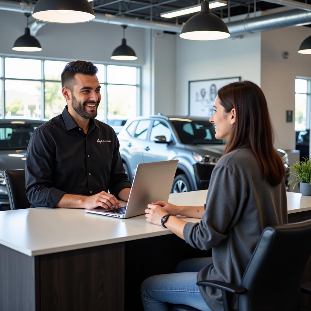 Customer service representative talking to a customer in an Orlando auto repair shop