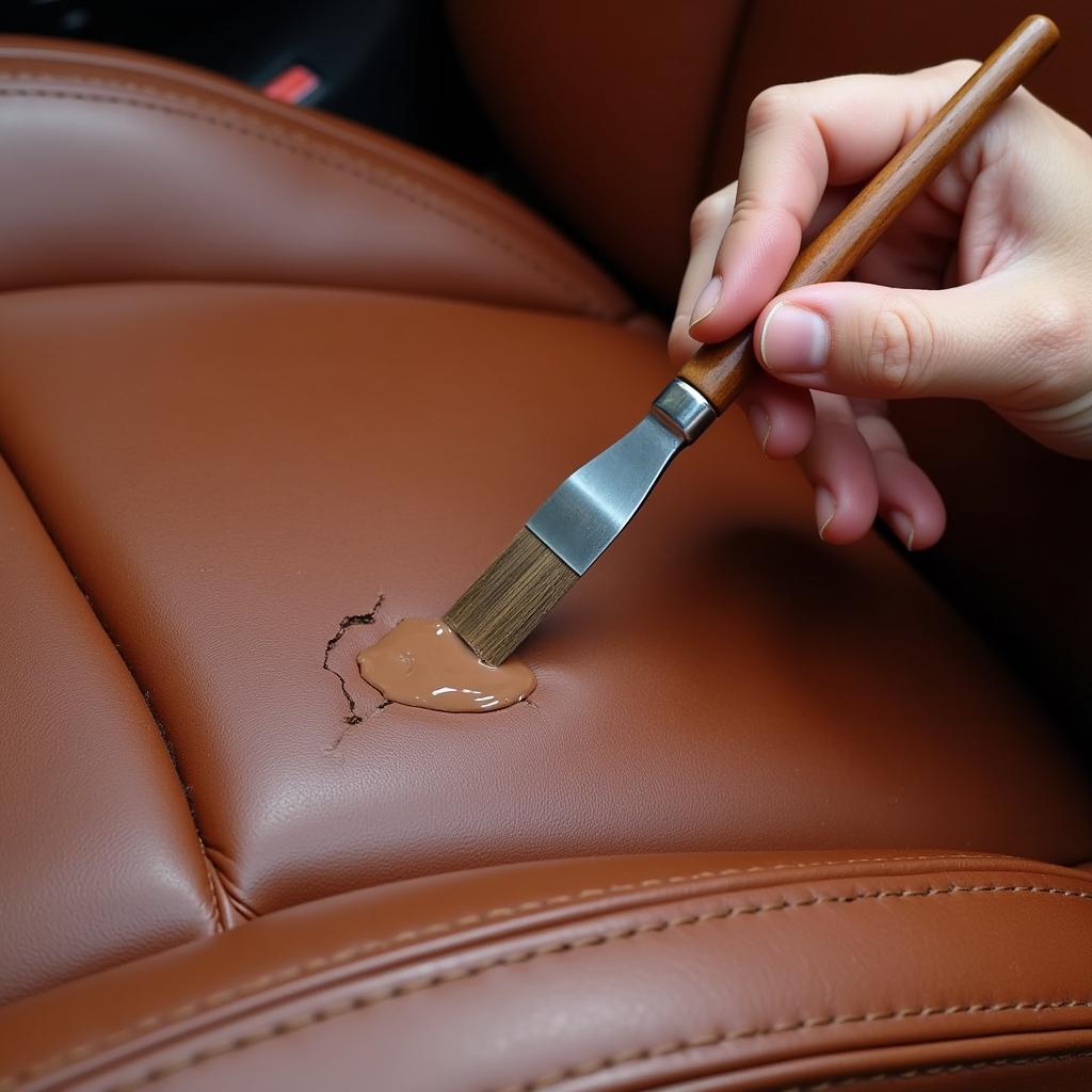 Applying leather filler to a cracked car seat