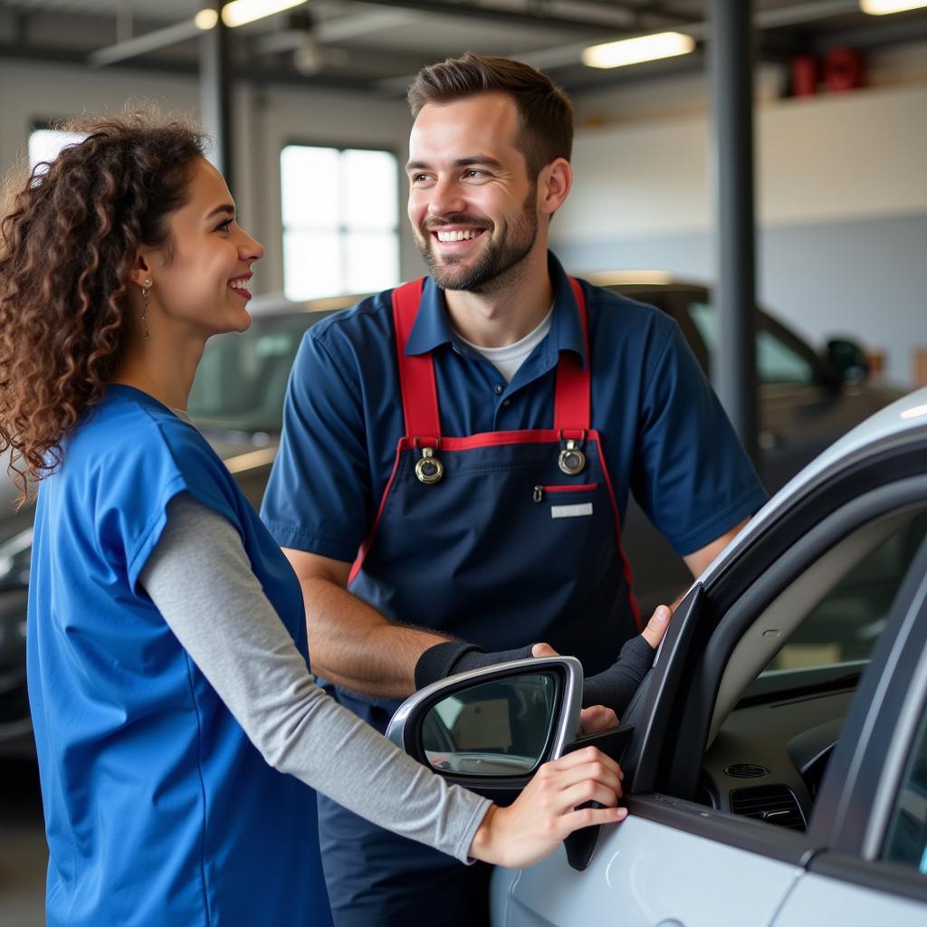 Satisfied Customer Receiving Repaired Car