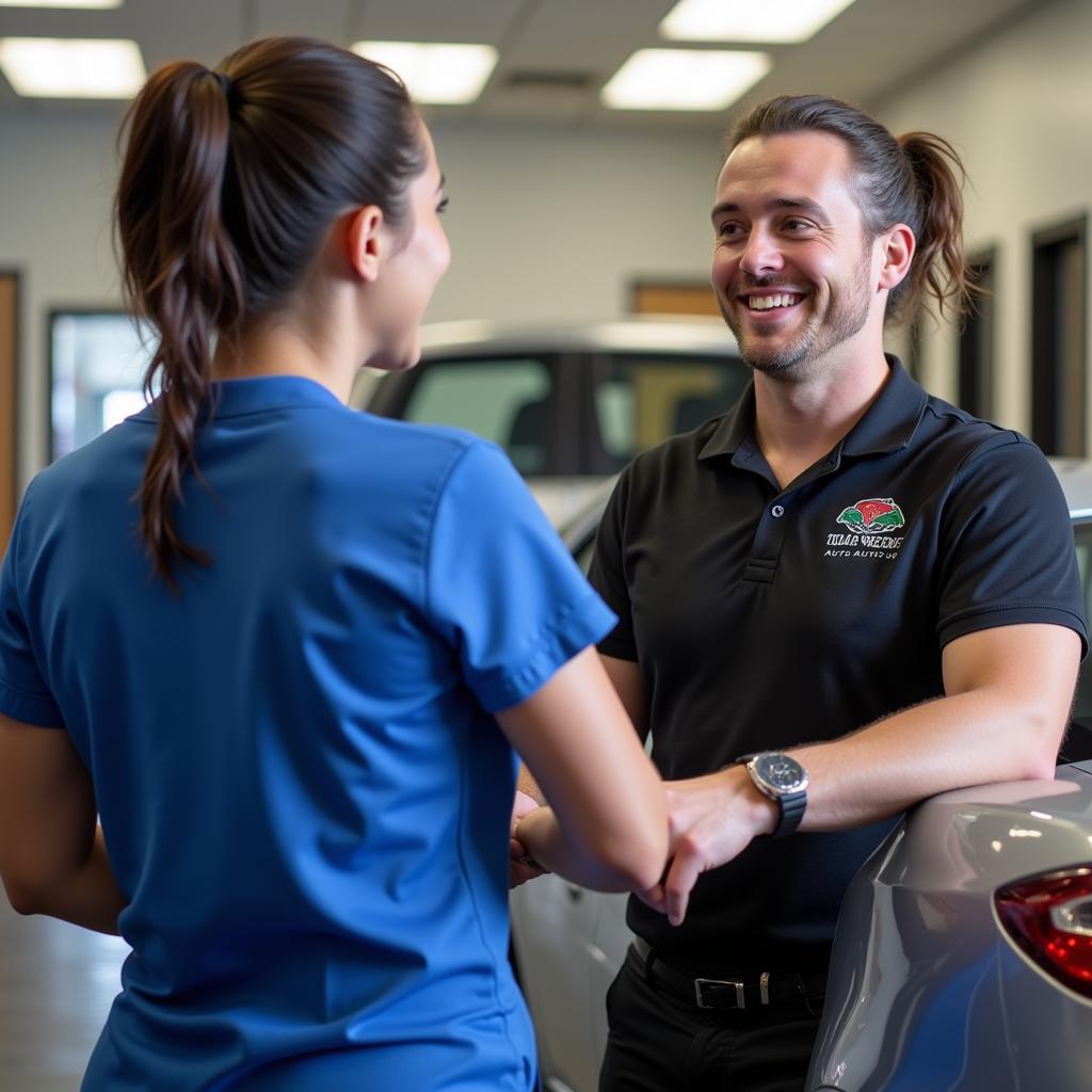 Customer Interacting with Tidal Wave Auto Spa Staff