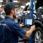 Experienced Technician Working on a Car at Air Park Auto Service Inc.