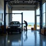 Car undergoing maintenance at a beach view auto service center