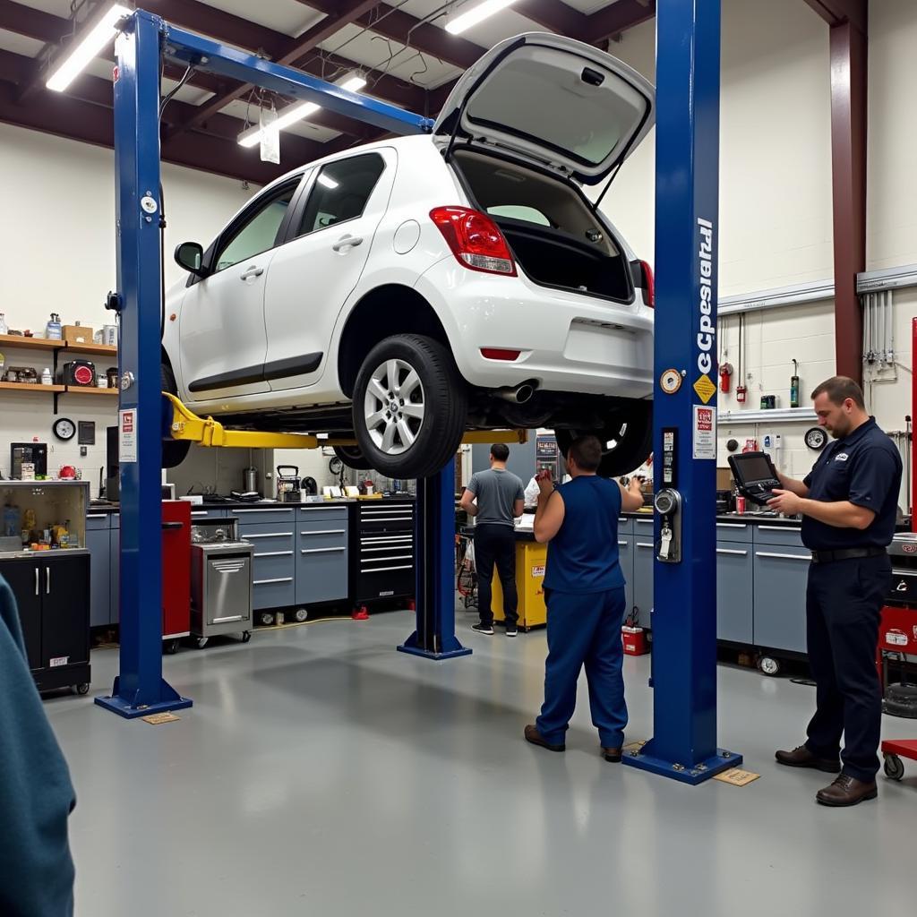 Car on a lift undergoing repair in a professional auto service center