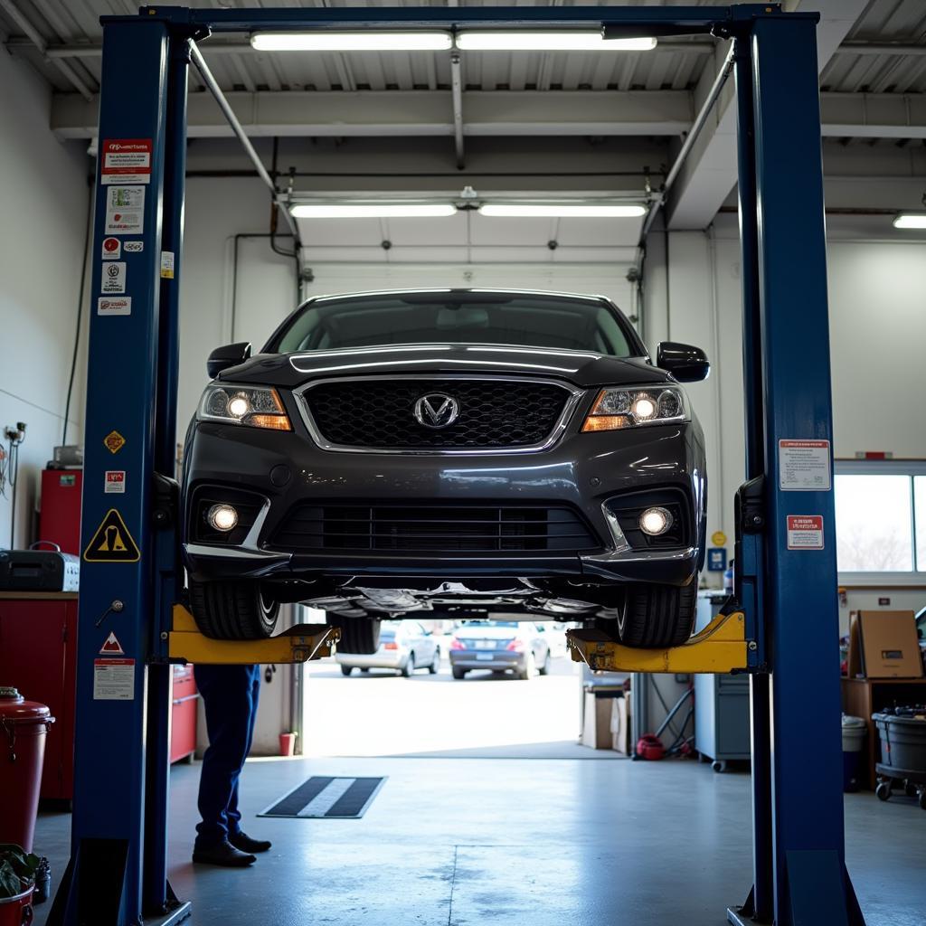 Car on a Lift in a Service Bay for Inspection