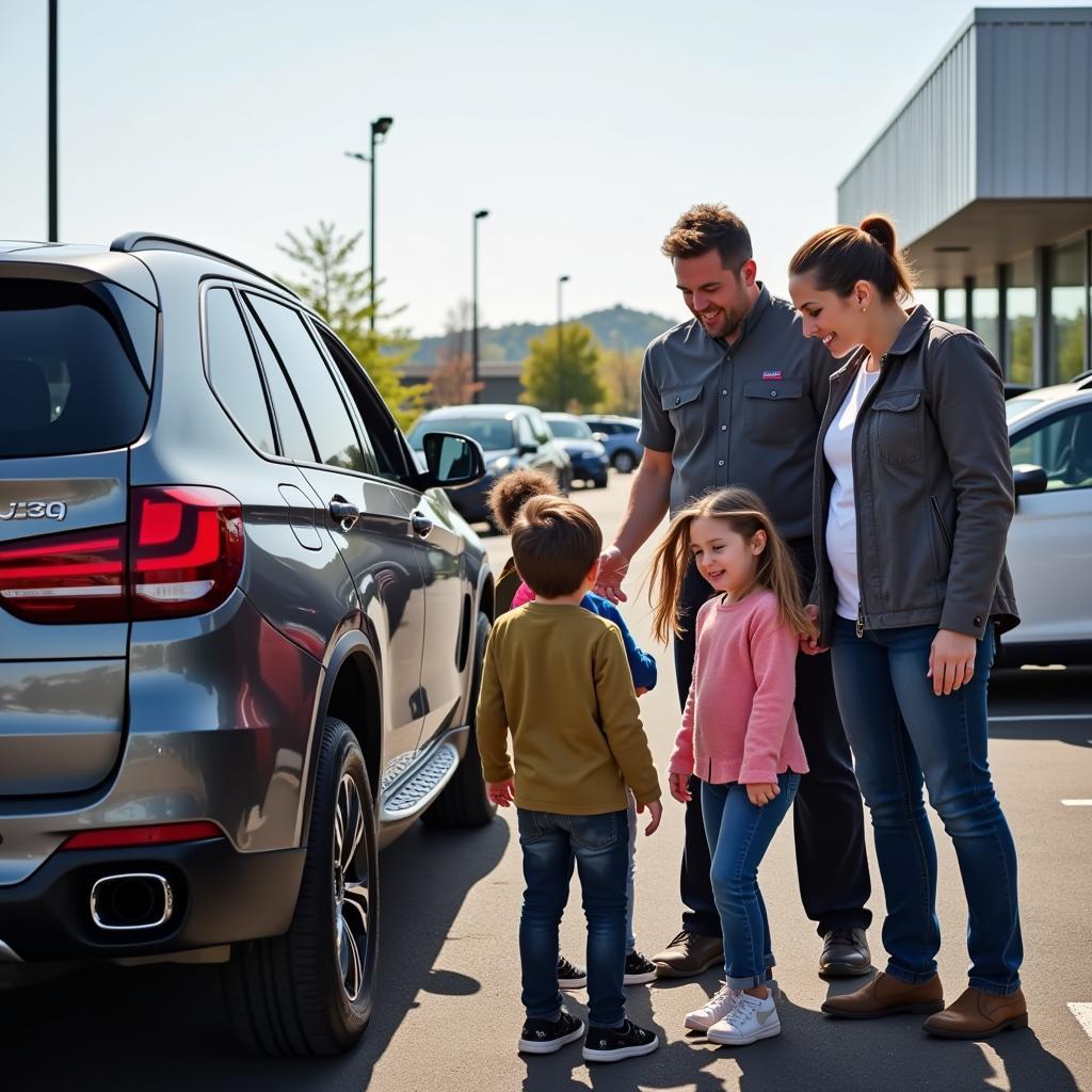 Family Choosing a Car at Town Hill Auto Sales