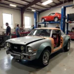 Classic car undergoing restoration in a professional shop in Atlantis, FL