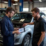 Customer Discussing Auto Repair Costs with a Mechanic in Watsonville