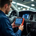 Mechanic Using a Diagnostic Tool on a Car