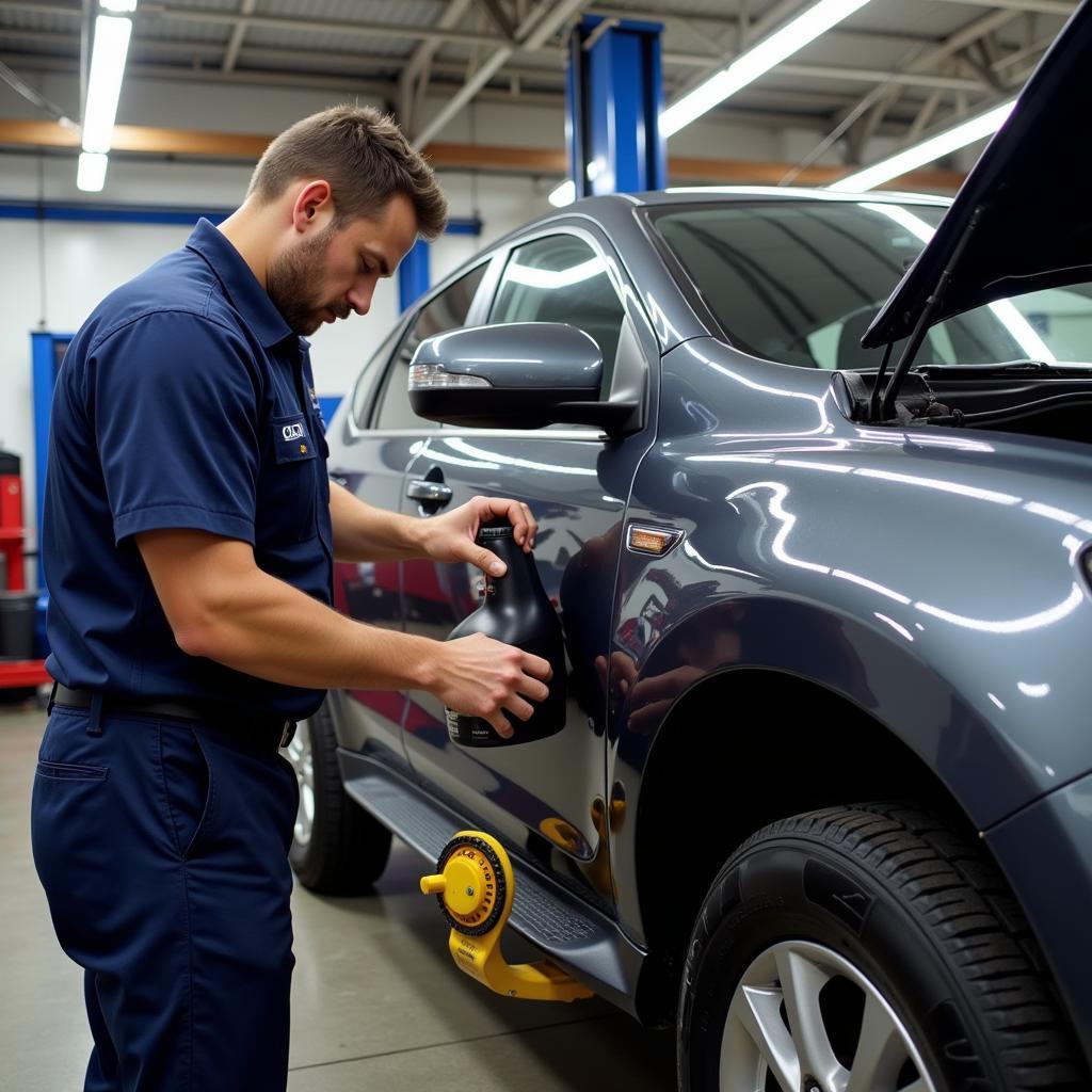 Mechanic Performing Routine Car Maintenance at Craig's Auto Service