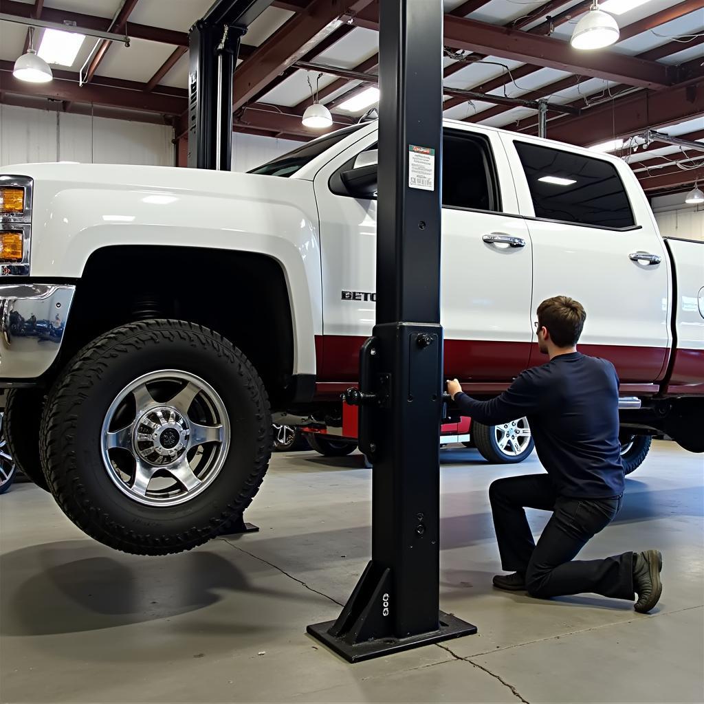 Mechanic Utilizing an Auto Service Lift