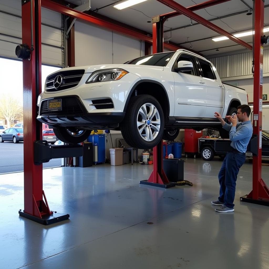 Car undergoing maintenance at a Northampton, MA auto service center.